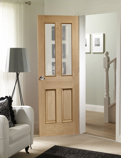 Internal Oak Malton Door With Raised Mouldings and Clear Bevelled Glass